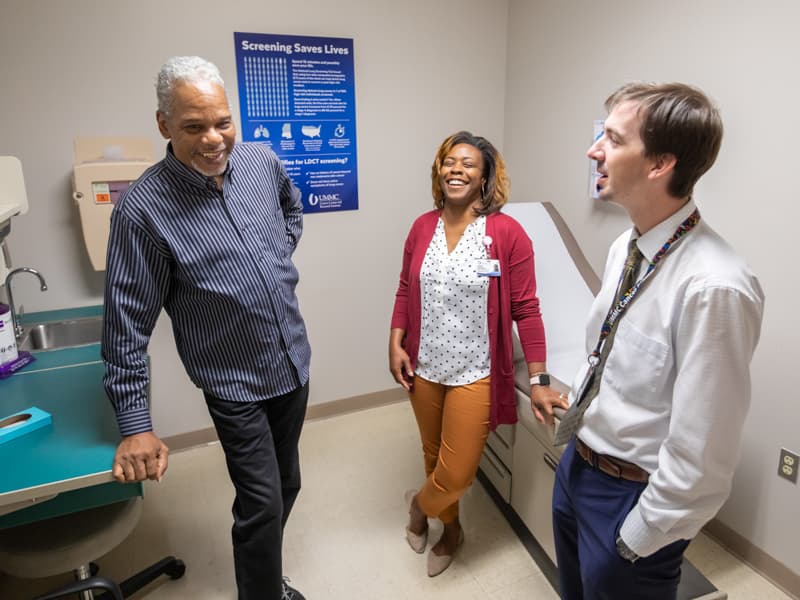 Ronald Givens of Byram, left, talks to Anastasia Smith-McEwen, his smoking cessation counselor, and Jonathan Hontzas, lung cancer screening program co-director.